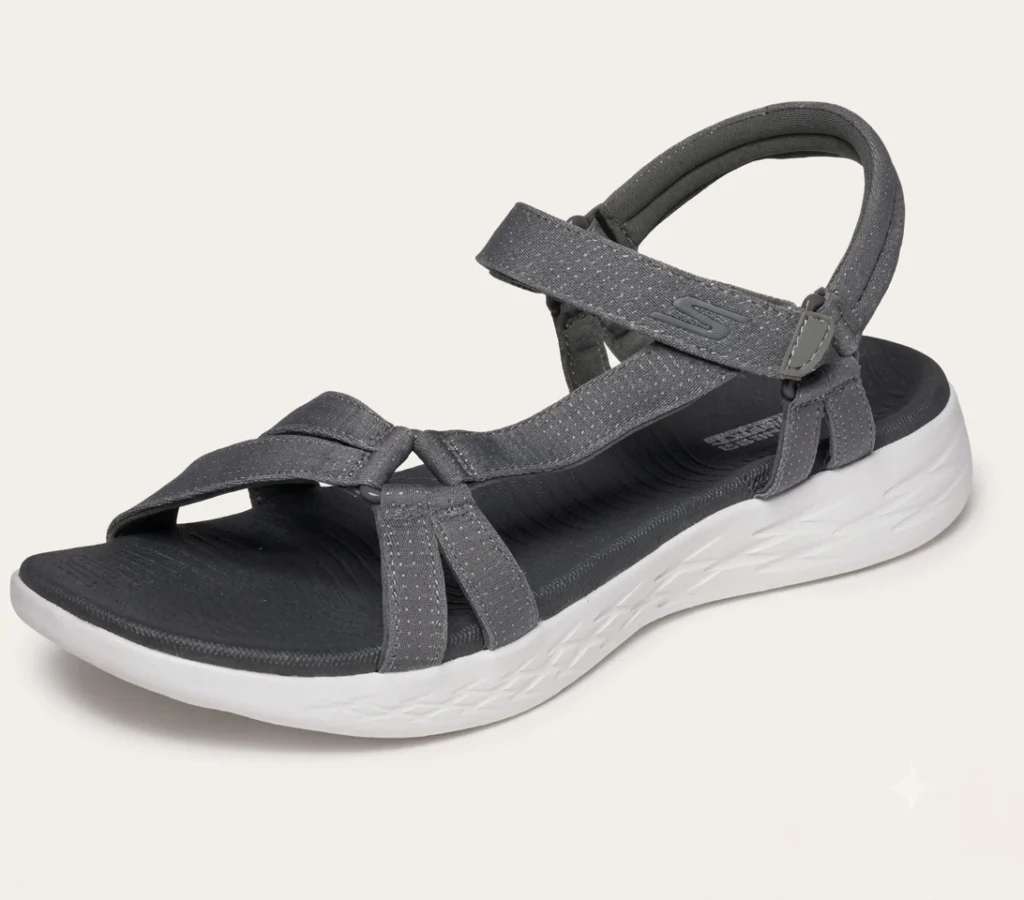 Woman stepping into a knit-strap arch-support sandal on a porch step